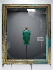 Green bottle with a gold lid in a frame.
